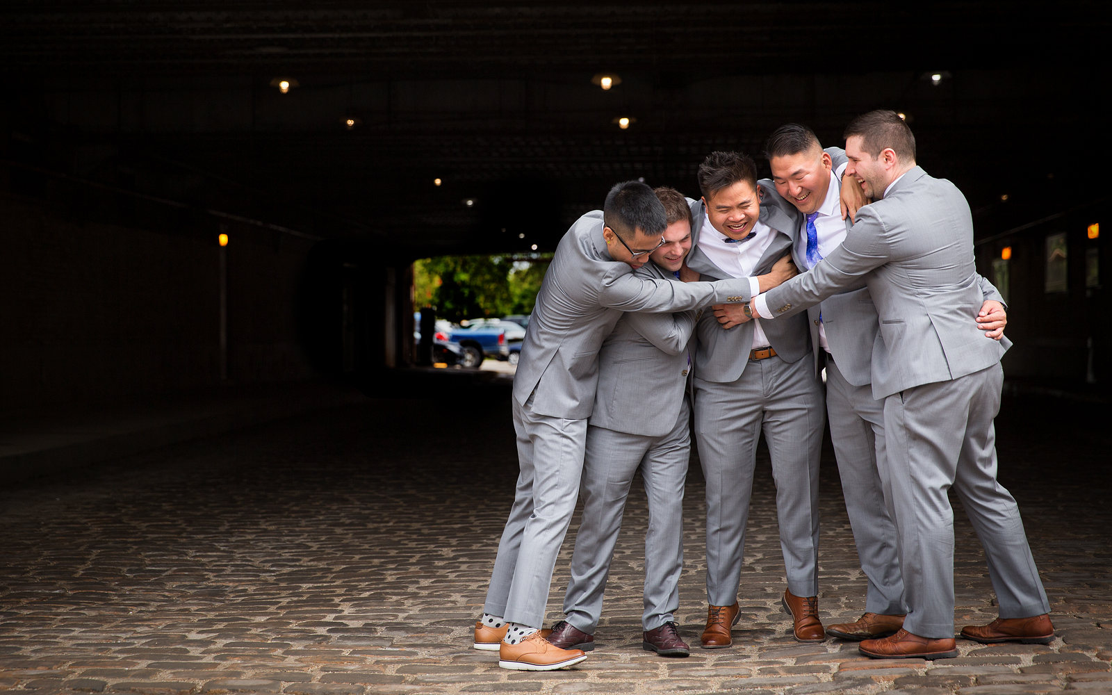 Chris hugging his groomsmen