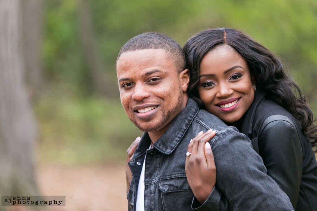 Sandra hugging Tayo from behind with big smiles