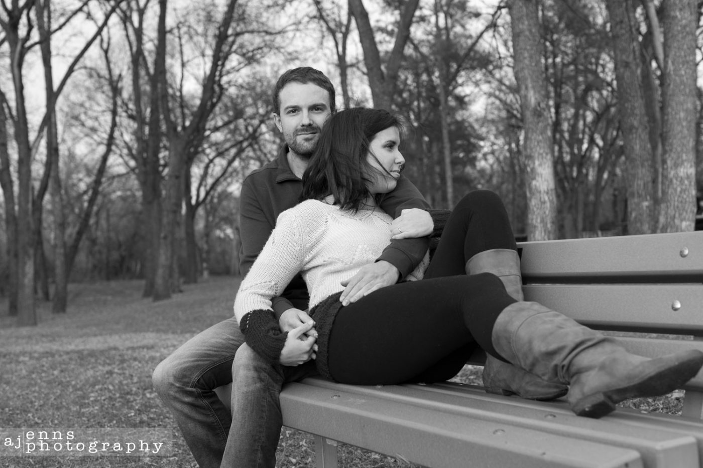 The two love birds sit on a park