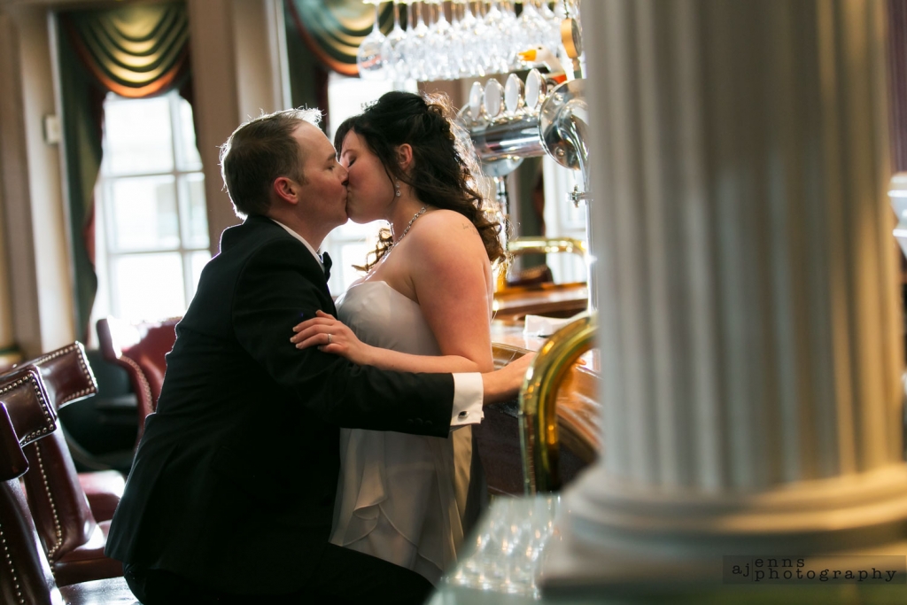 Romantic wedding kiss in the bar of the Hotel Fort Garry