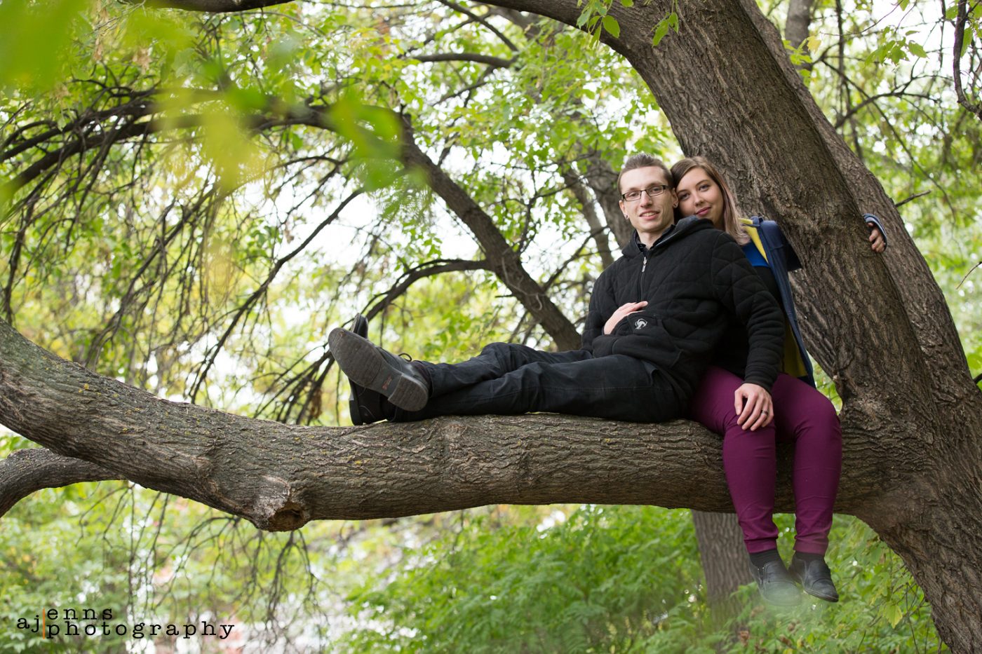 Robyn and Darryl sitting a tree branch