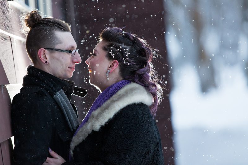 Gazing into each other's eyes while the snow gently falls around them
