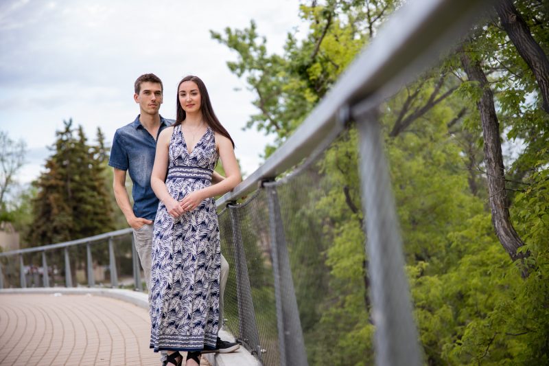 The couple standing on the new foot bridge along Tache