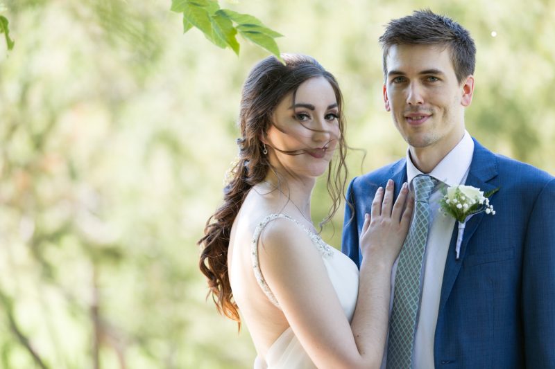 The couple in a dreamy pose as they both stare into the camera with the background out of focus