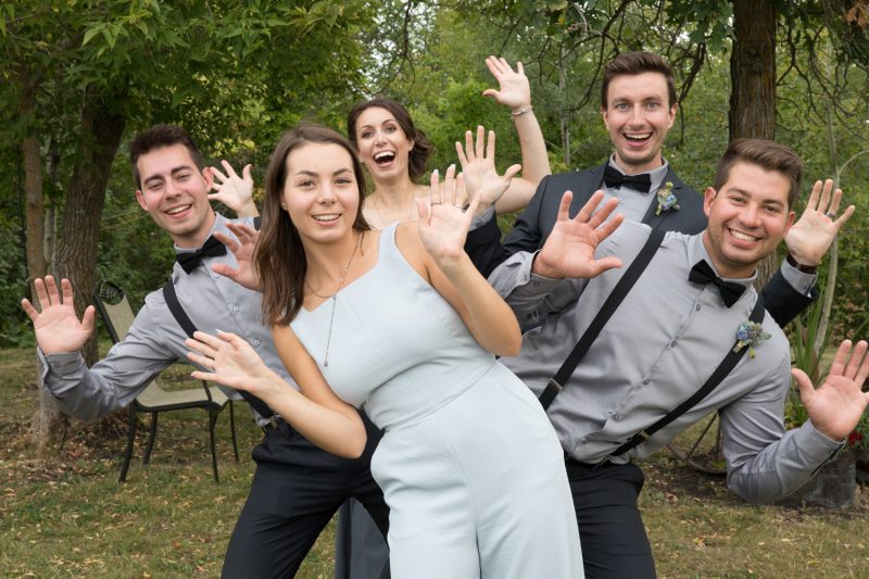 Siblings in a row all with jazz hands