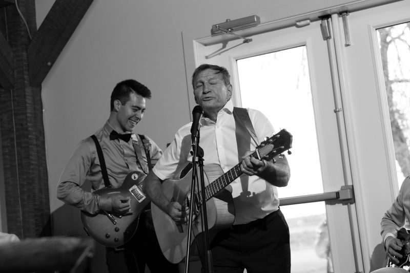 Father of the bride singing a rock song during the reception