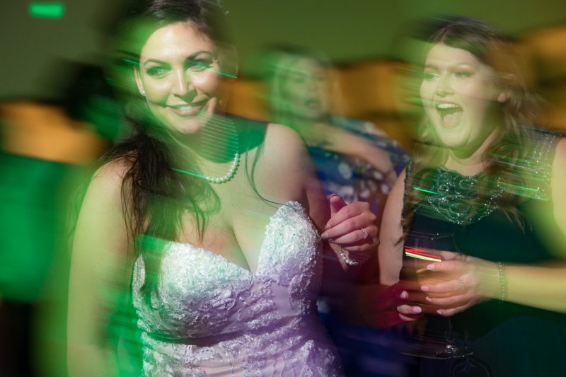 Slow motion image of Jenn and her maid of honour on the dance floor