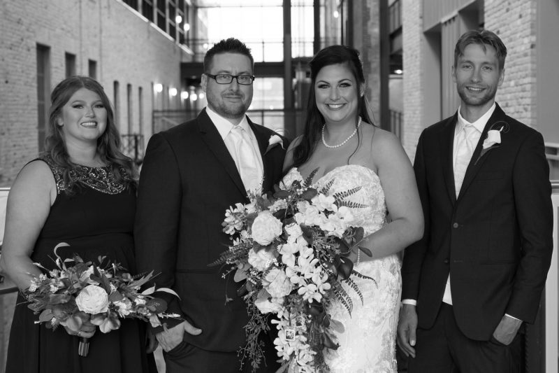 the bridal party at the walkway at the Red River Collage Campus