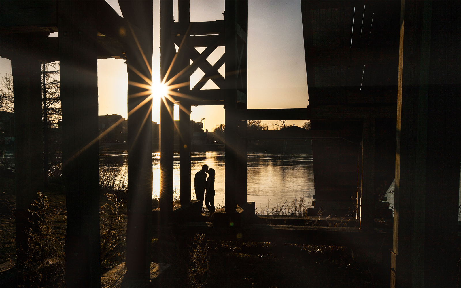 Kissing under the toboggan bridge at sunset