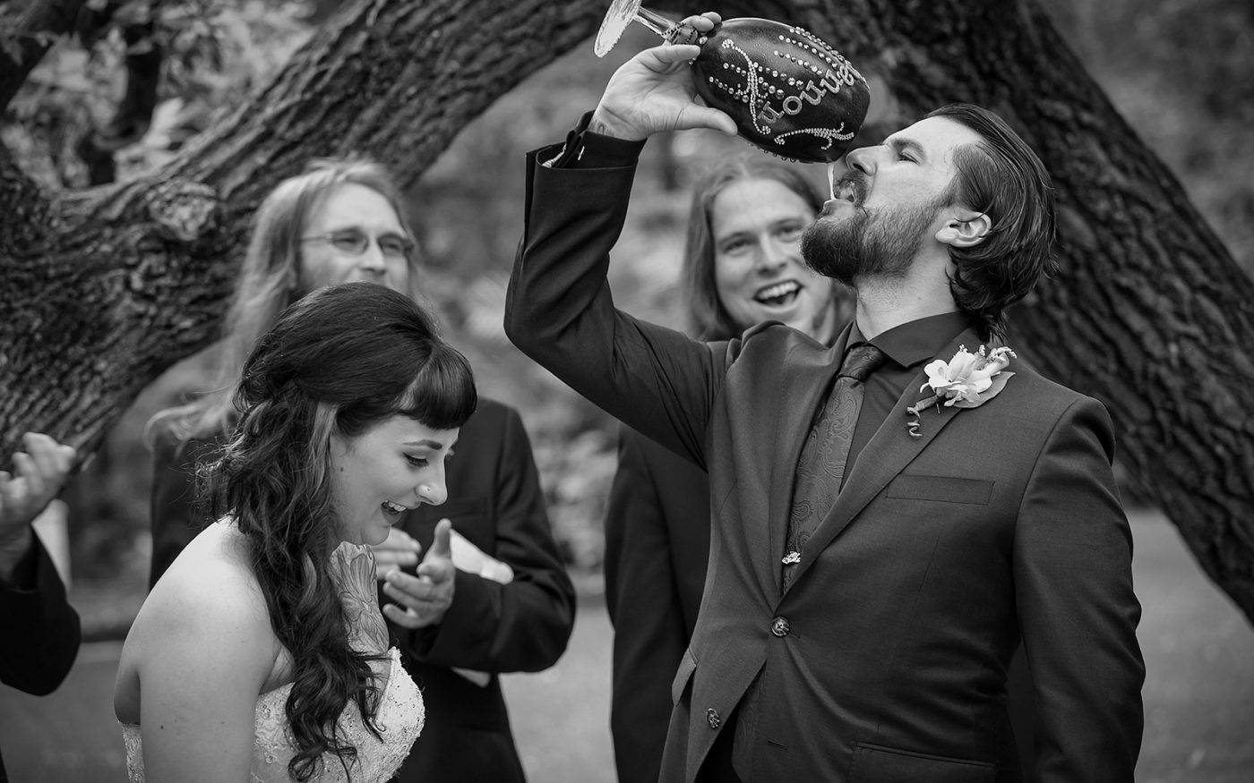 Derek drinking a beer to seal their wedding