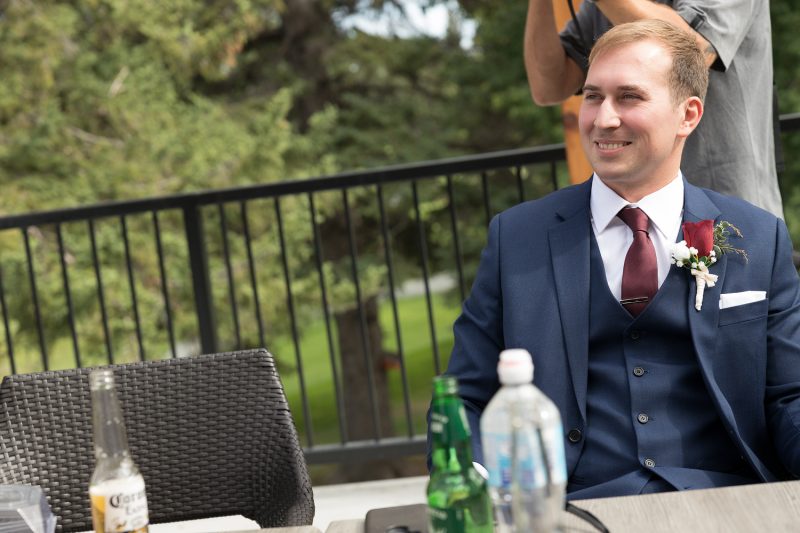 The groom chilling on the patio before the ceremony