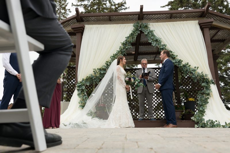 The couple in front of the gazebo at Elmhurst