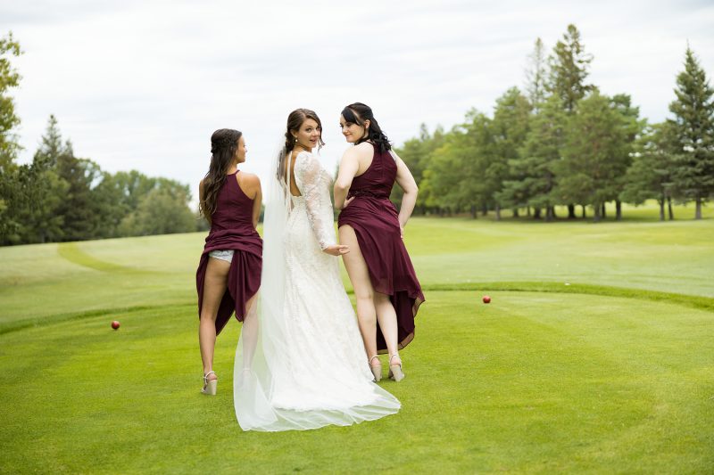 The bridesmaids showing their asses while the Bride looks on