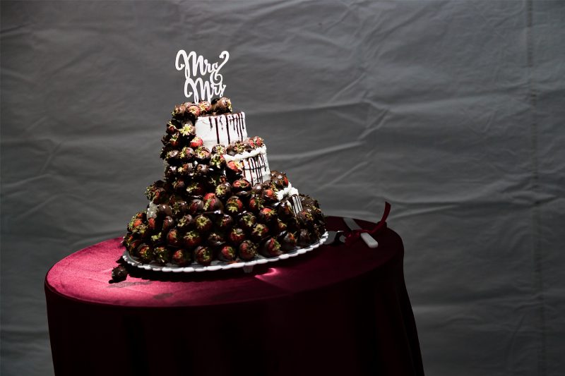 The wedding cake covered in Chocolate dipped strawberries