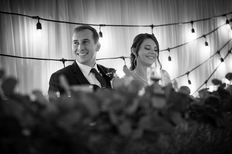 Romantic shot of the couple smiling during speeches