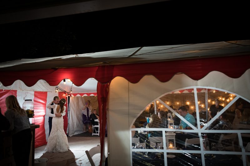 A wide angle shot of the first dance under the tent