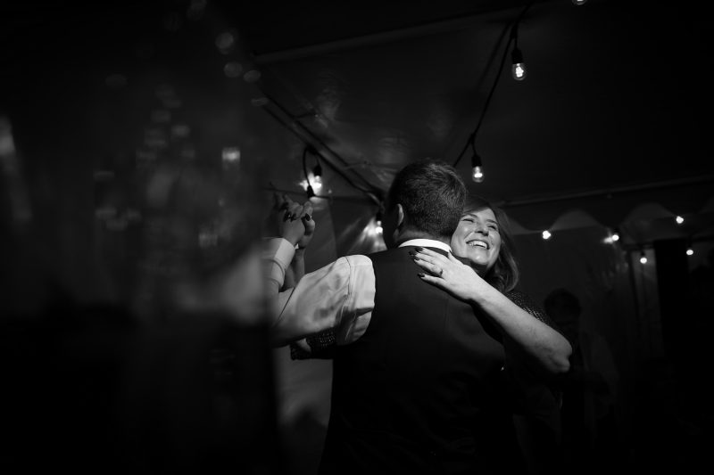 The mother son dance with a huge smile on mom's face