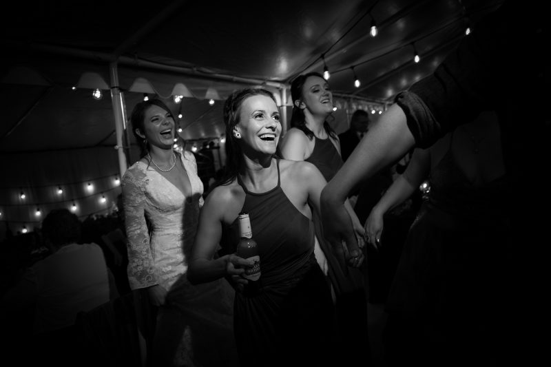 the maid of honour with a huge smiling while dancing
