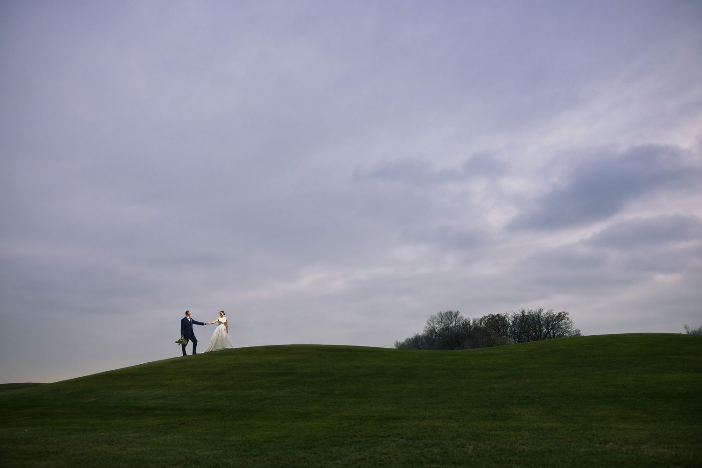 Jasmine pulling Matt up a hill at Bridges Golf Course