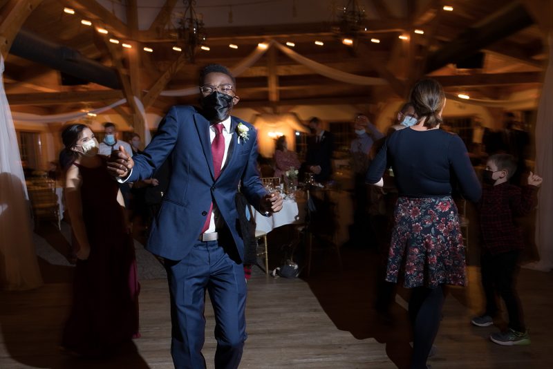 Groomsman busting a move on the dance floor