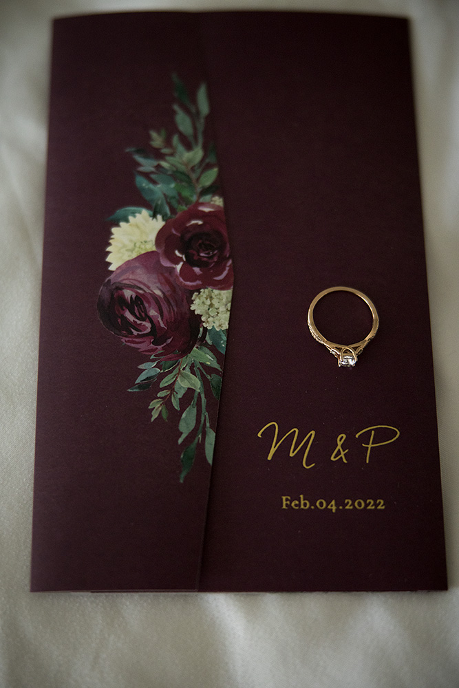Meaghan's engagement ring on the wedding invite