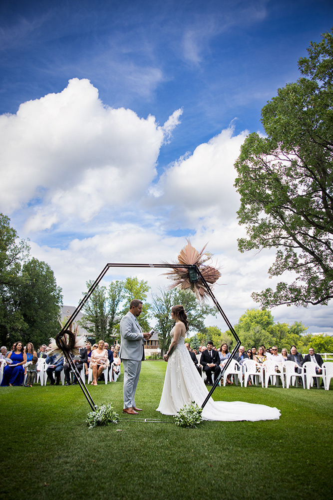 Another ceremony shot while the couple shares vows at Southwood Golf & Country Club